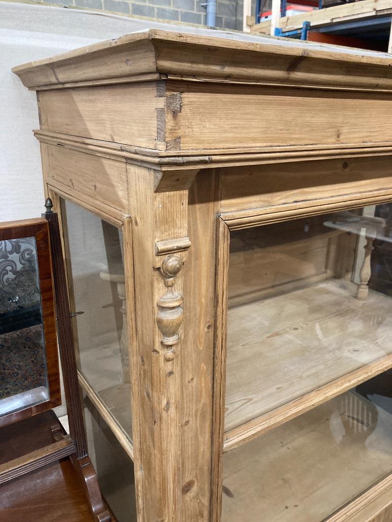 A 19th century East European pine vitrine, width 104cm, depth 52cm, height 170cm